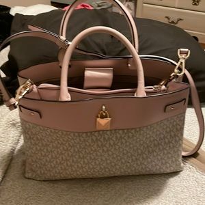 Pink, brown and off white Micheal Kors purse with detachable strap.
